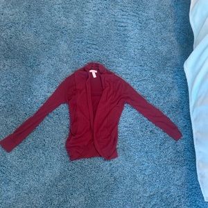 Shorter maroon cardigan.